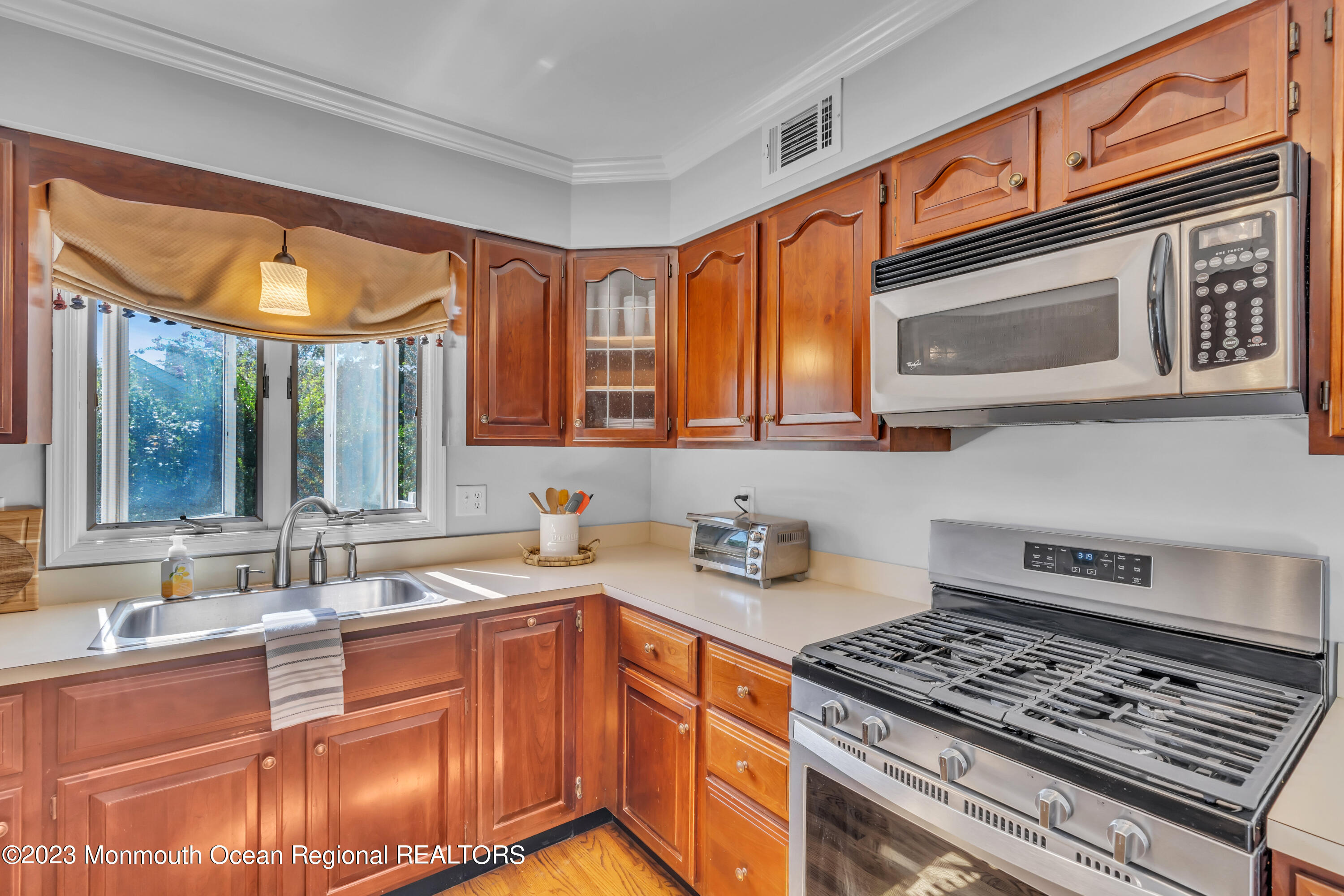 608 Brielle Avenue Brielle, NJ 08730 - Photo 30 of 56 a kitchen with stainless steel appliances granite countertop a stove and a sink