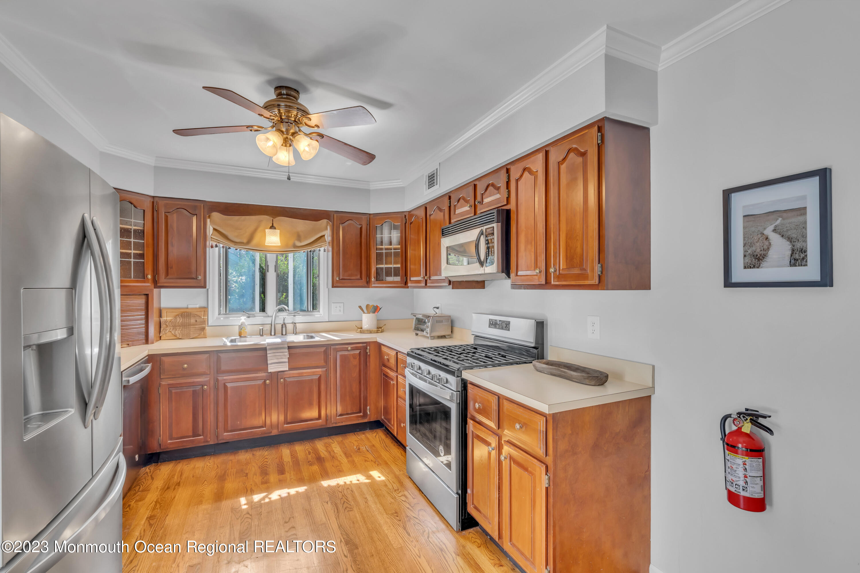 608 Brielle Avenue Brielle, NJ 08730 - Photo 31 of 56 a kitchen with a stove a sink and a refrigerator