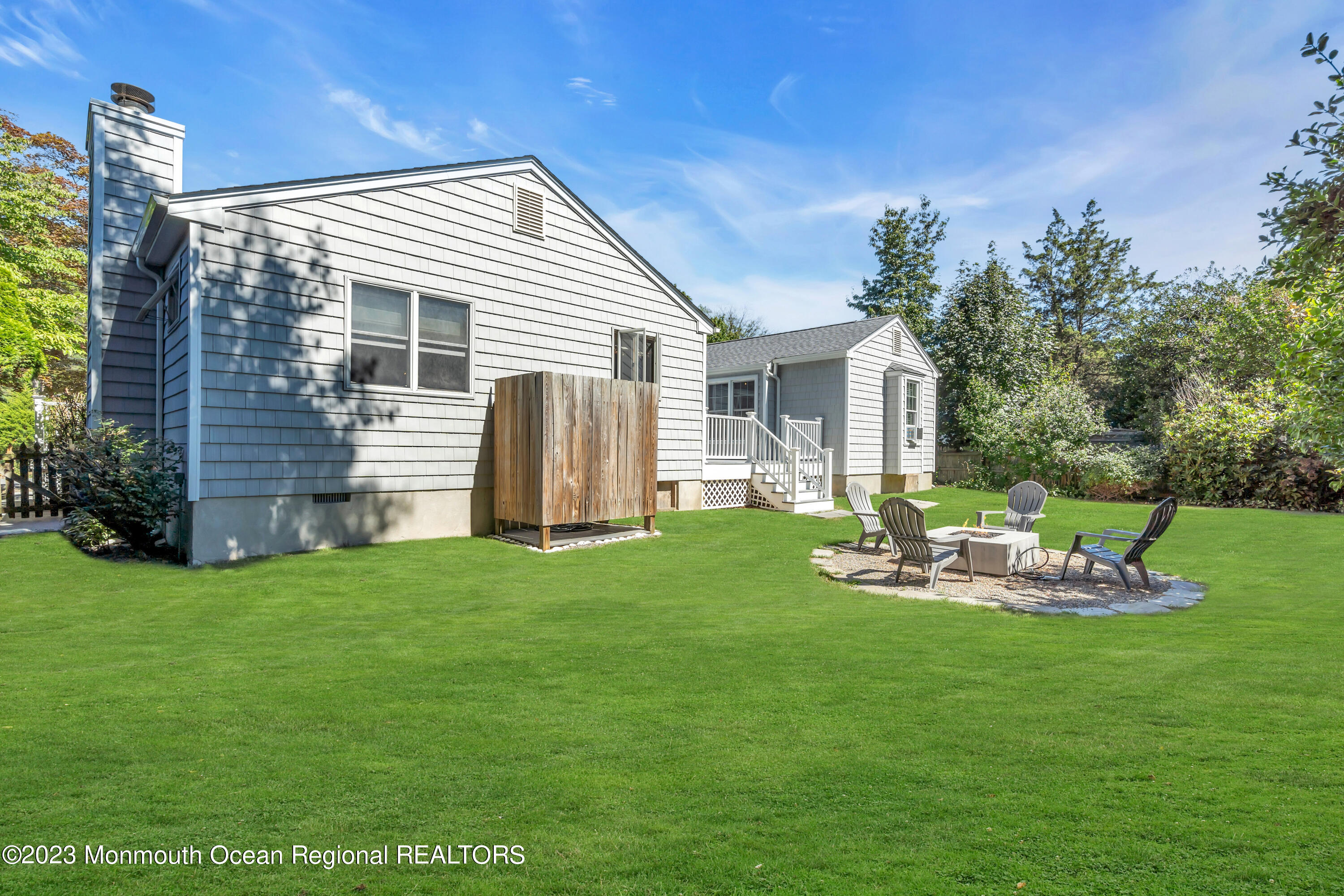 608 Brielle Avenue Brielle, NJ 08730 - Photo 33 of 56 a front view of house with a garden and patio