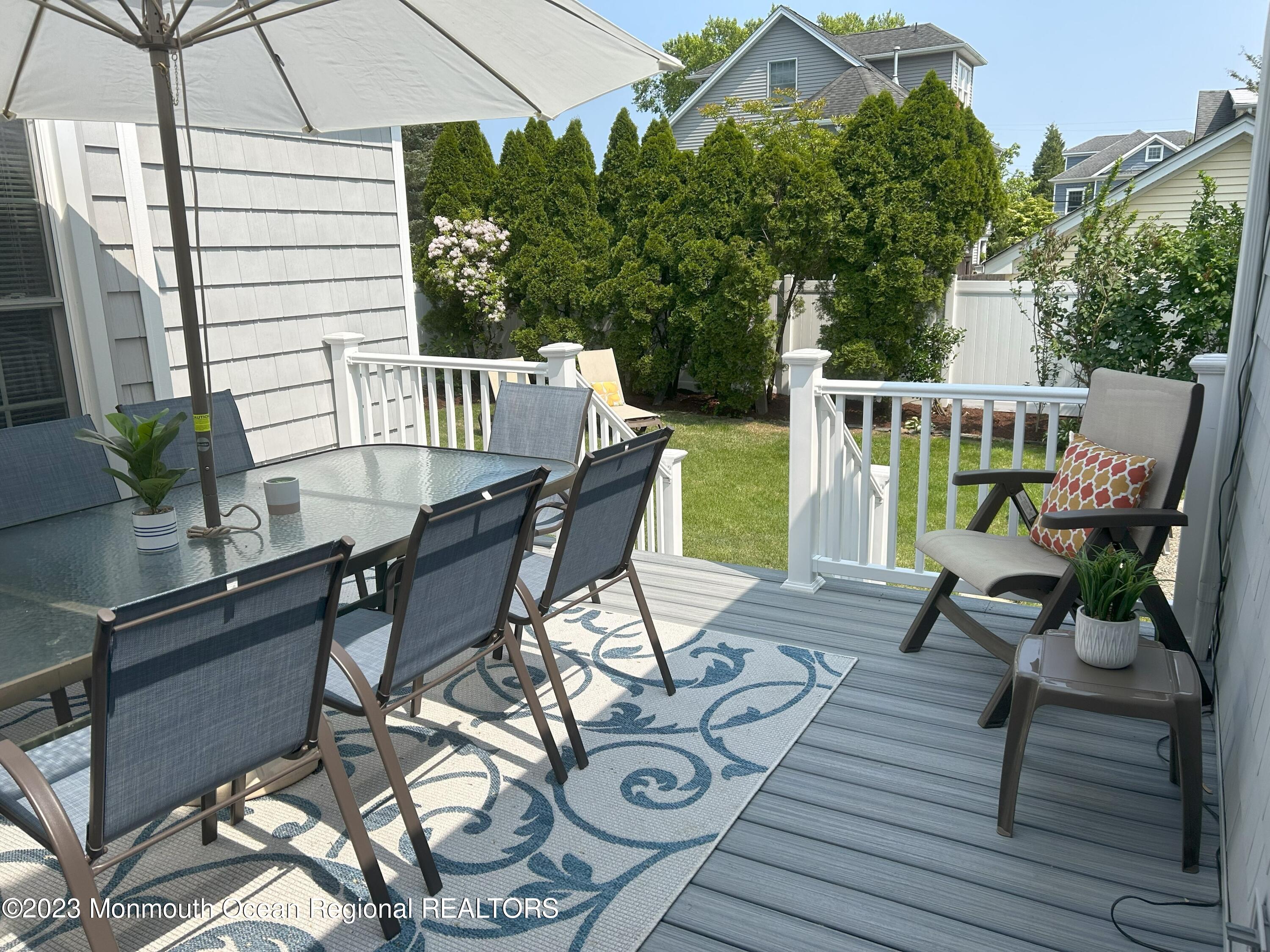 608 Brielle Avenue Brielle, NJ 08730 - Photo 38 of 56 a view of a chairs and table on the deck