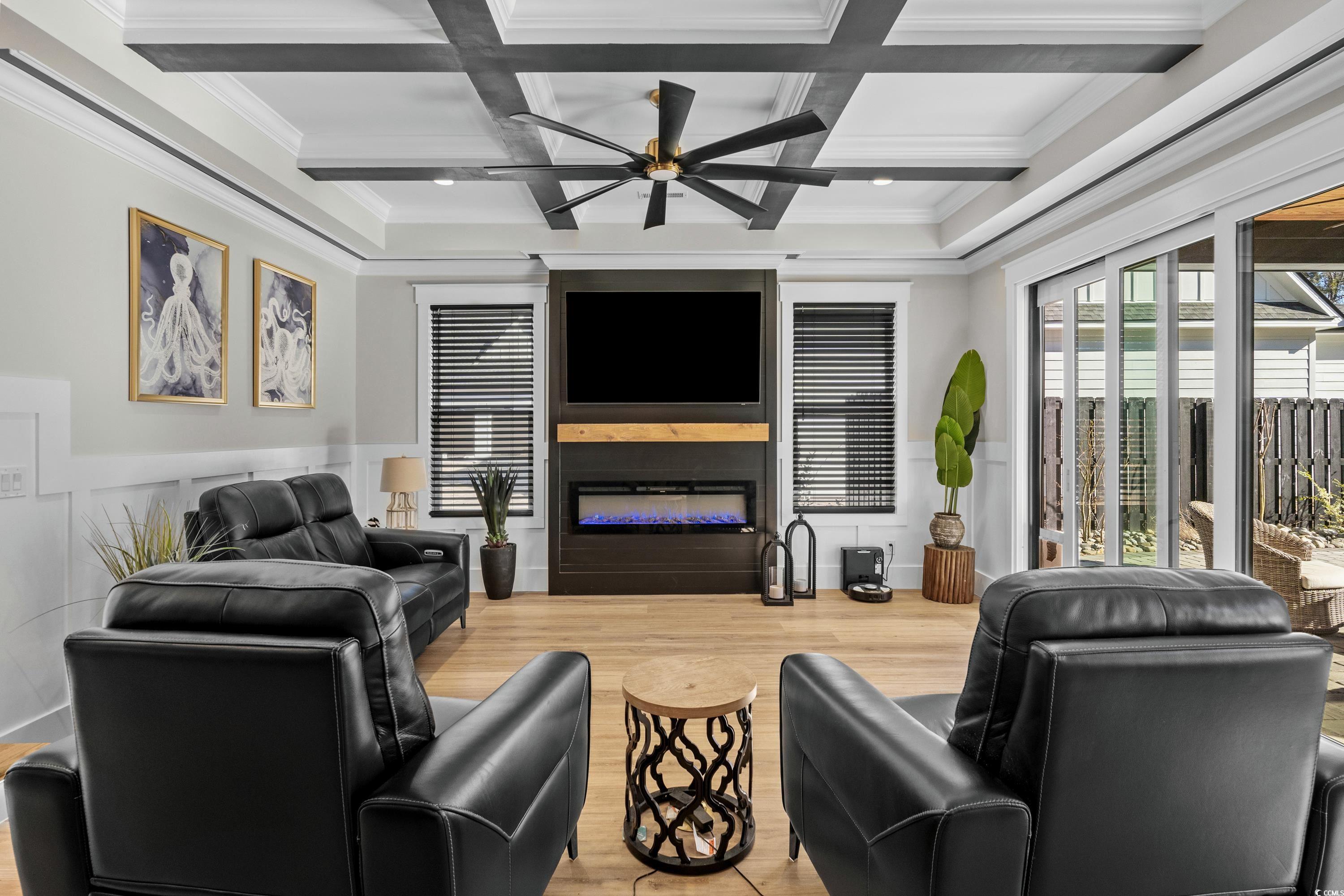3427 Dewey Road Myrtle Beach, SC 29579 - Photo 18 of 40 Living area with beamed ceiling, a large fireplace