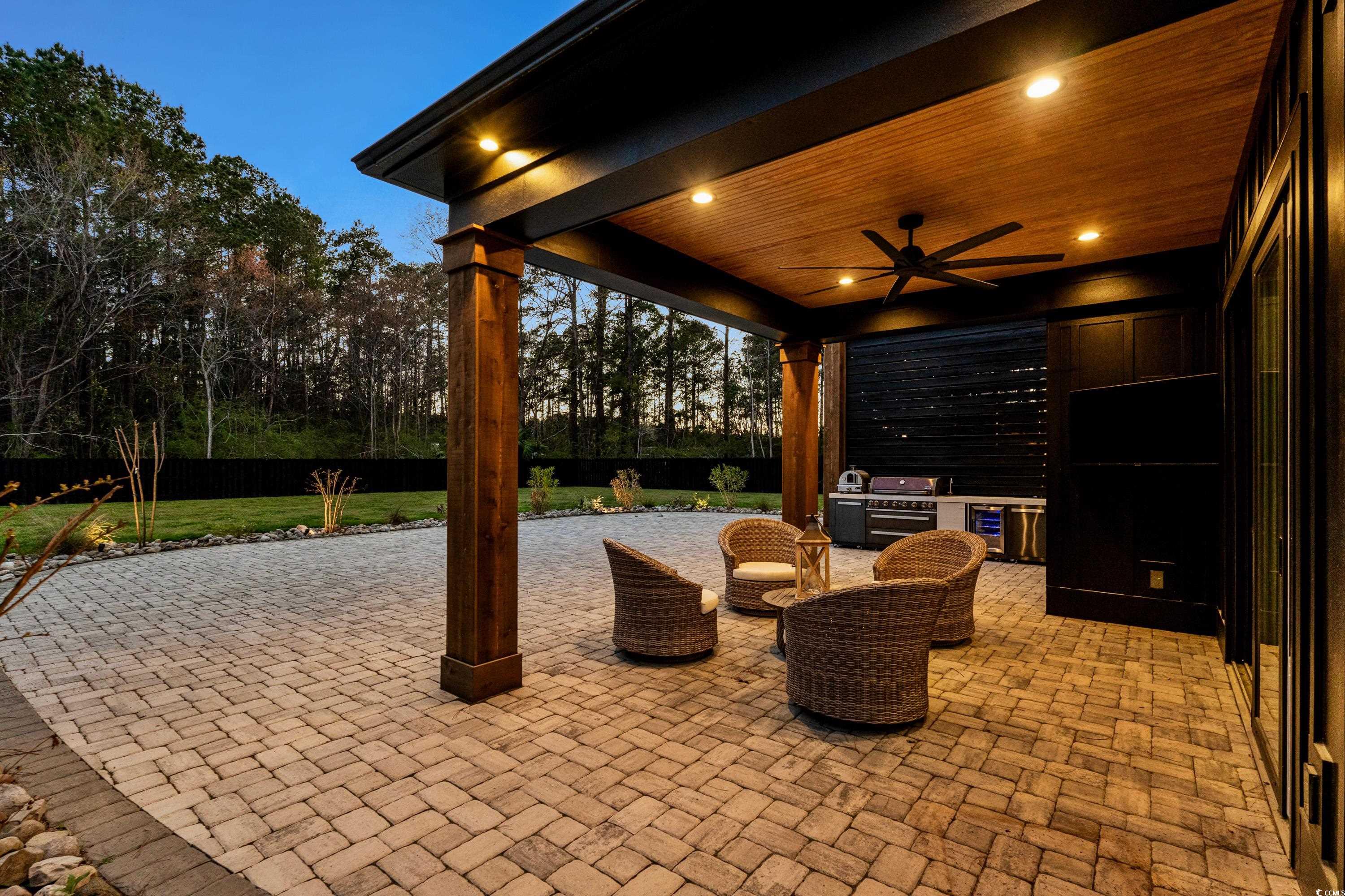 View of patio featuring exterior kitchen, a ceilin