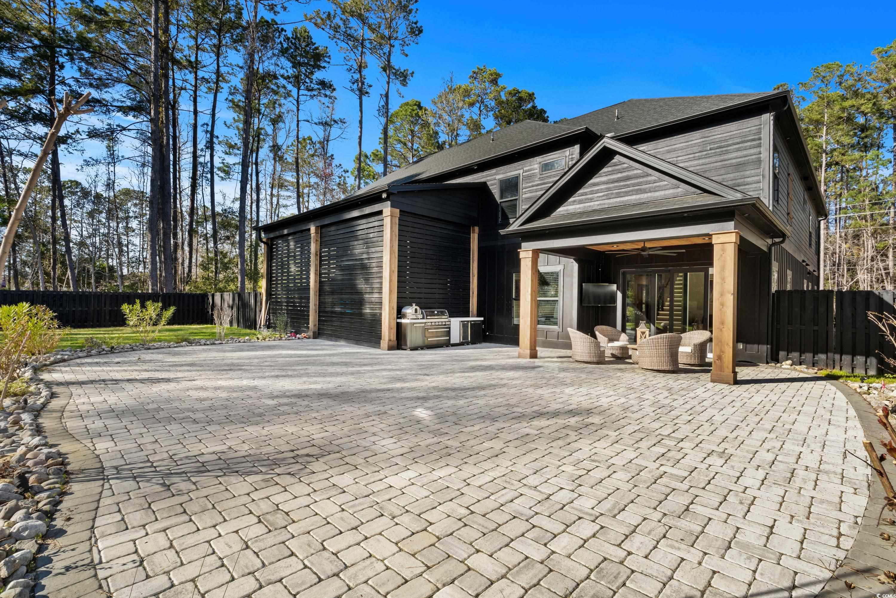 Rear view of property with outdoor lounge area, an