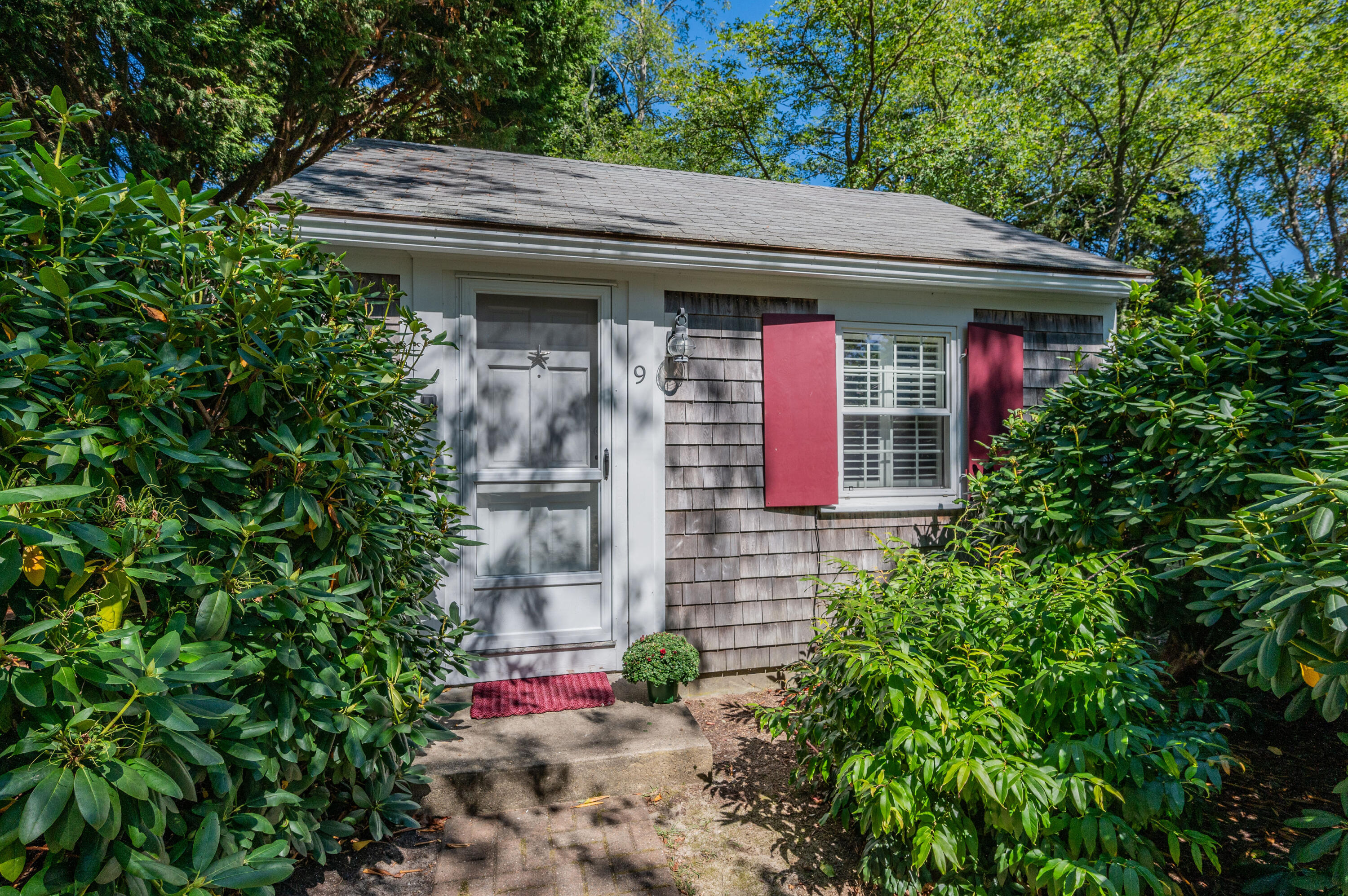 785 State Highway, Unit 9 Eastham, MA 02642 - Photo 2 of 30 a front view of a house with yard