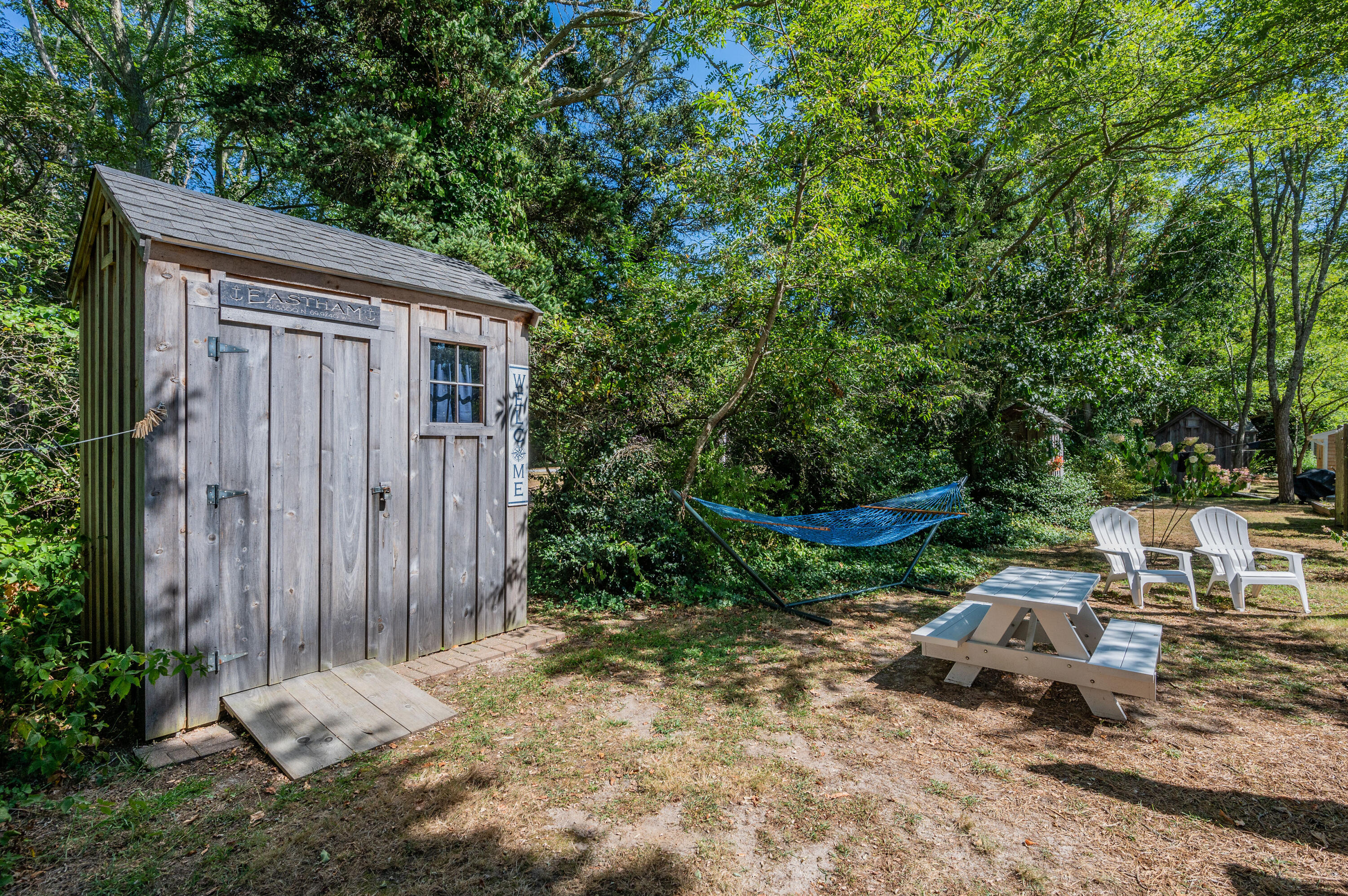 785 State Highway, Unit 9 Eastham, MA 02642 - Photo 23 of 30 a backyard of a house with lots of green space