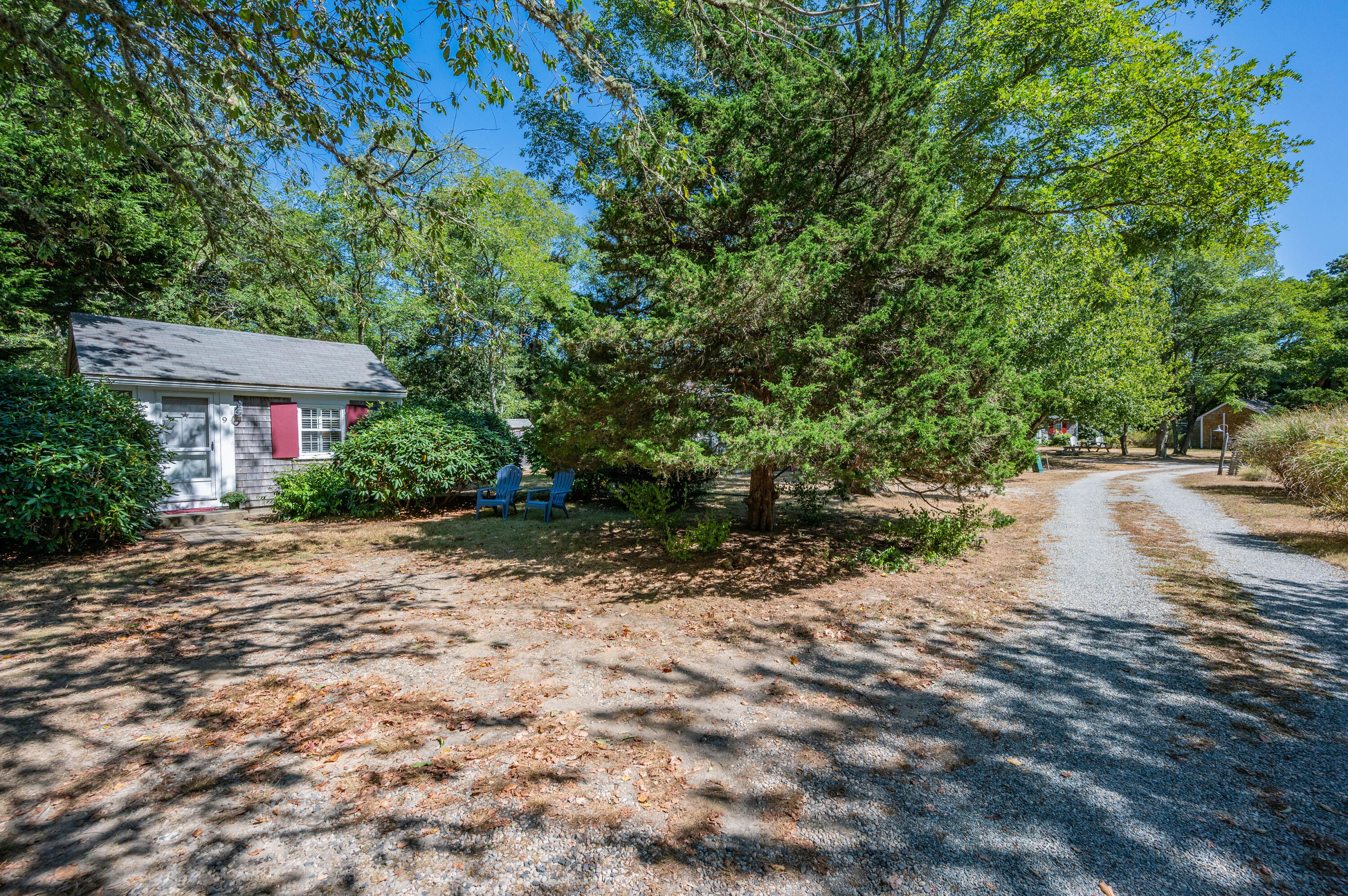 785 State Highway, Unit 9 Eastham, MA 02642 - Photo 4 of 30 a backyard of a house with lots of green space