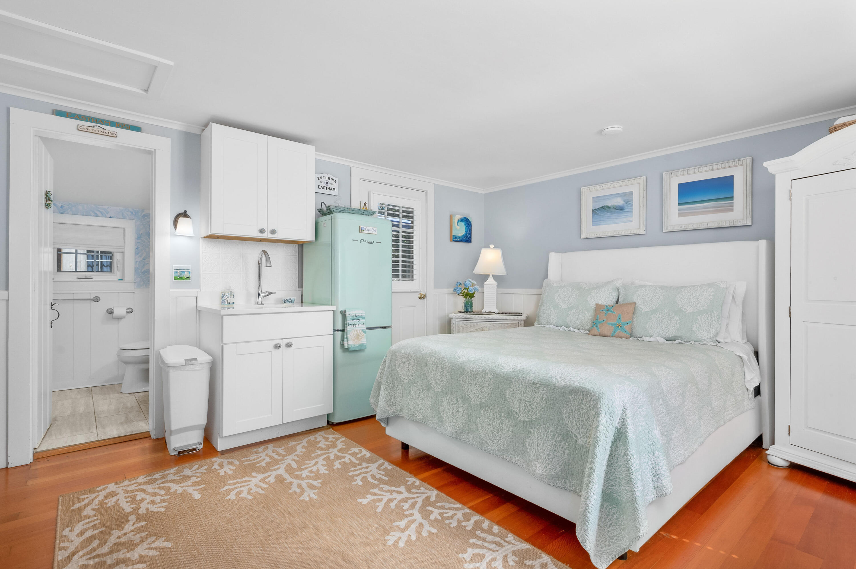 785 State Highway, Unit 9 Eastham, MA 02642 - Photo 6 of 30 a bedroom with a bed and a cabinets