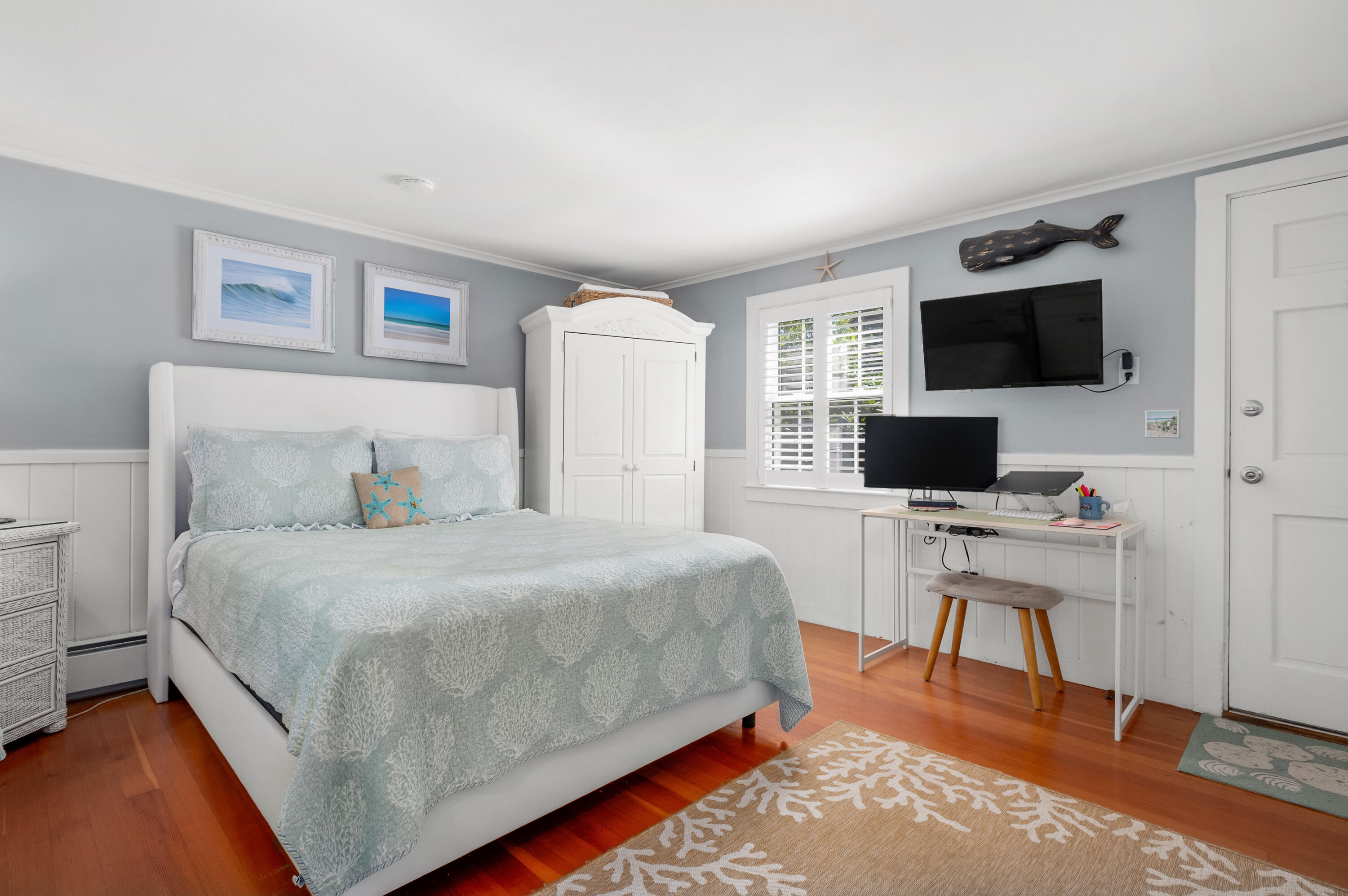 785 State Highway, Unit 9 Eastham, MA 02642 - Photo 7 of 30 a bedroom with a bed and a flat screen tv