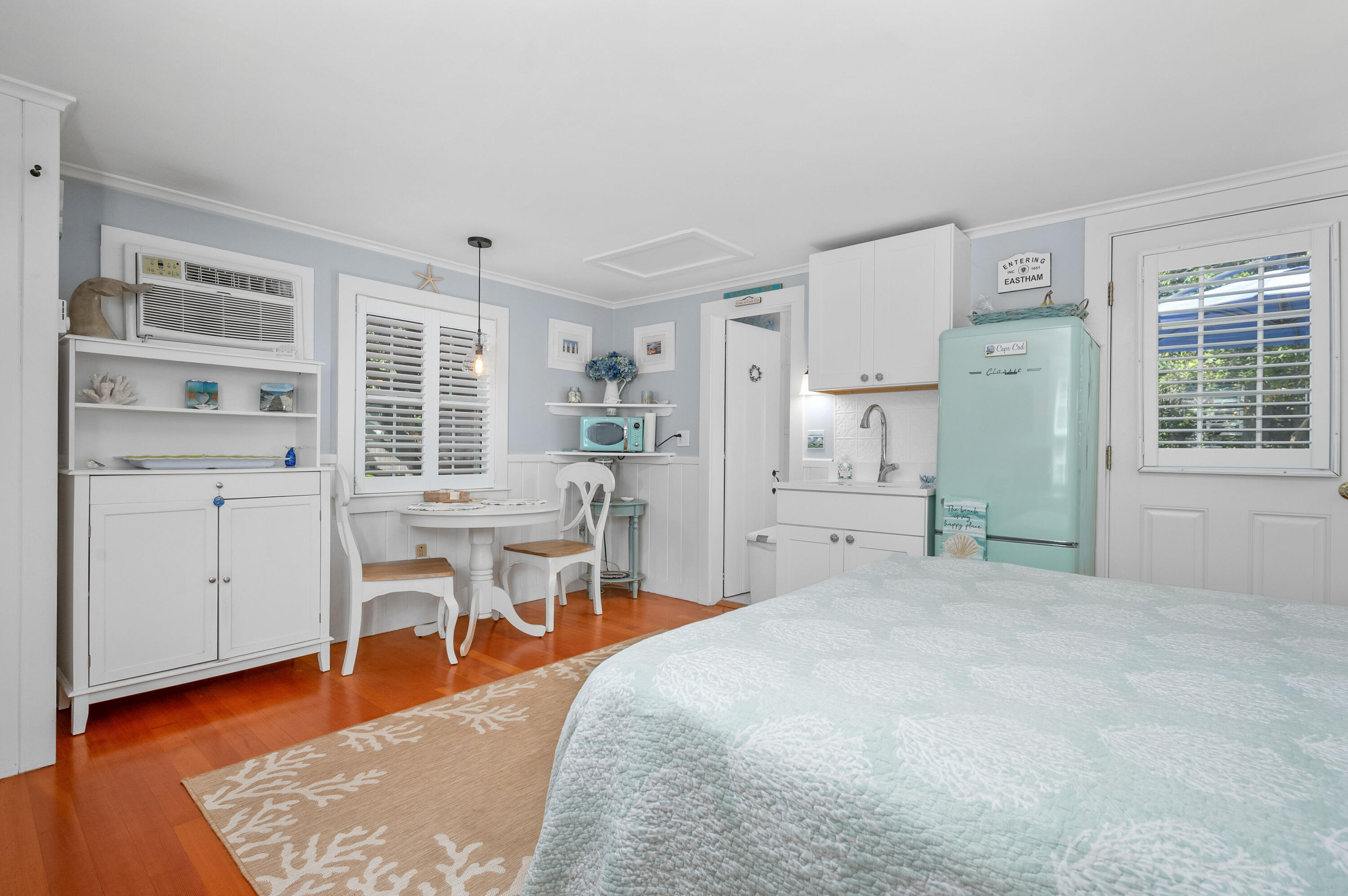 785 State Highway, Unit 9 Eastham, MA 02642 - Photo 8 of 30 a bedroom with furniture and a wooden floor