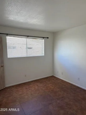 an empty room with a empty space and window