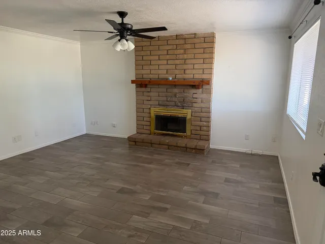 a view of empty room with fireplace