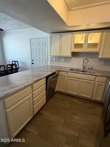 a kitchen with a sink and cabinets
