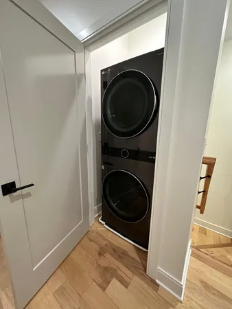 a view of a hallway with washer and dryer