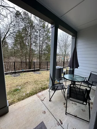 a view of a two chairs in the patio