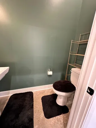 a bathroom with a toilet and a sink