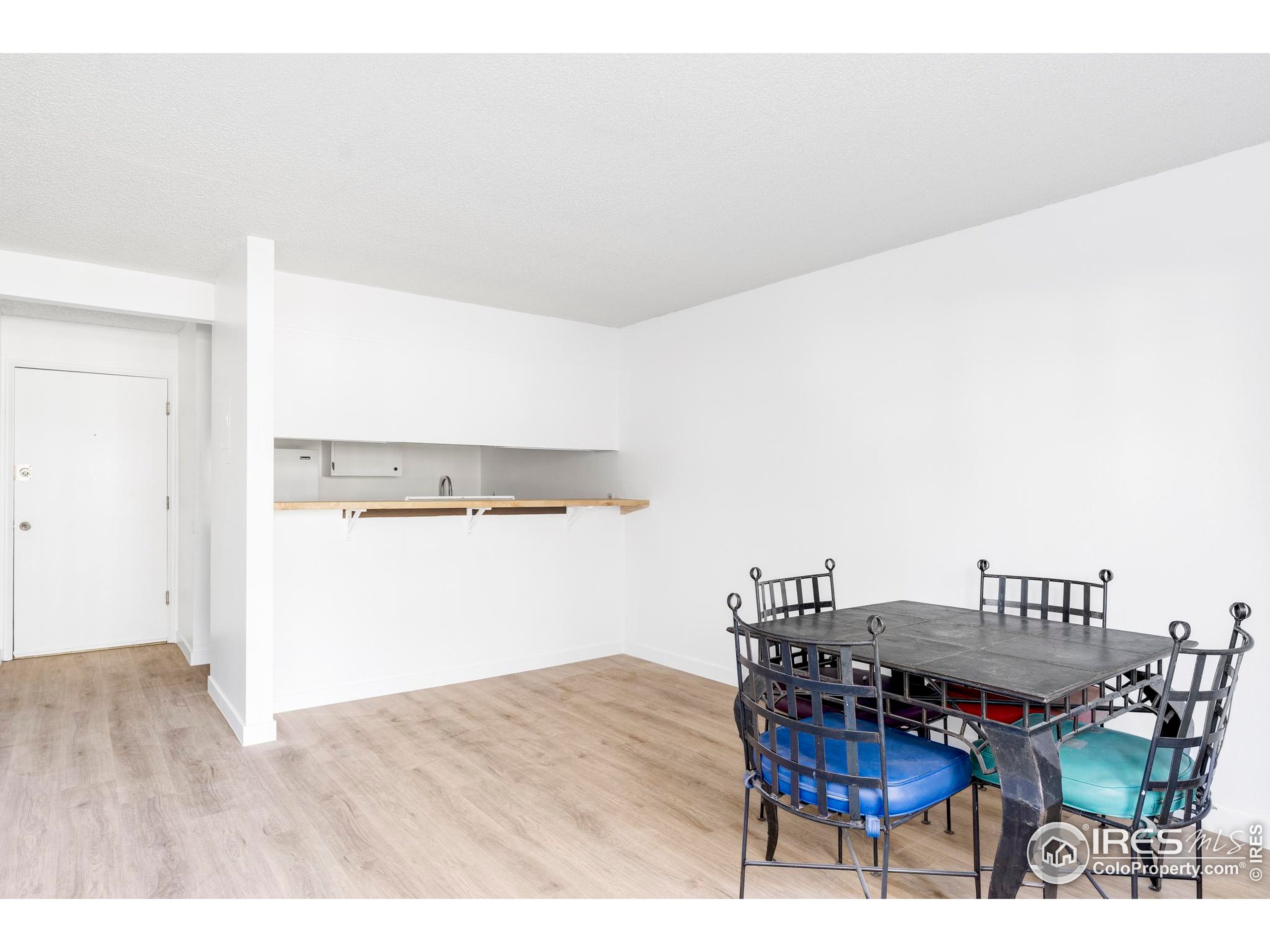 2707 Valmont Road, Unit 205D Boulder, CO 80304 - Photo 5 of 18 a workspace with furniture and wooden floor