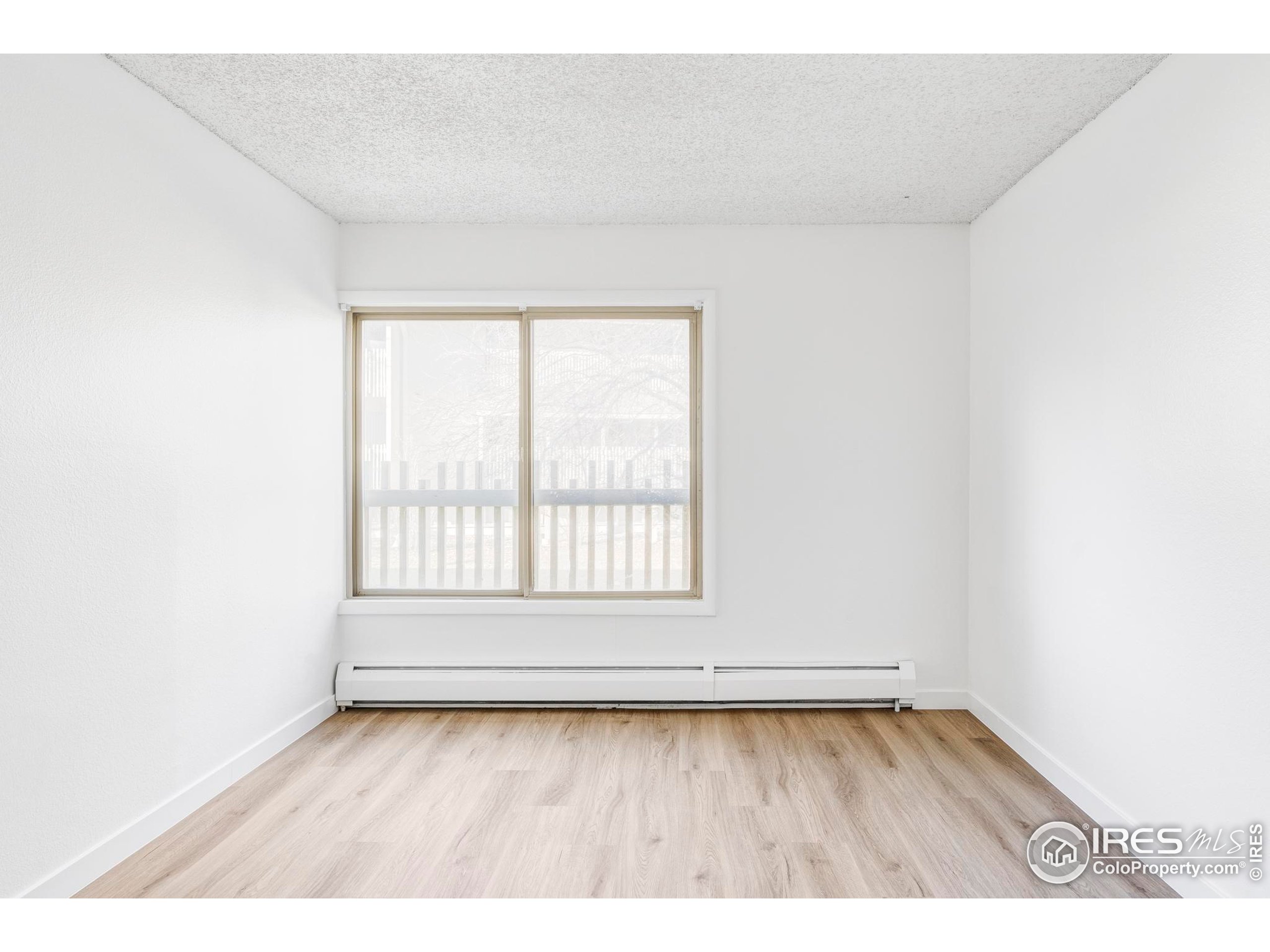 2707 Valmont Road, Unit 205D Boulder, CO 80304 - Photo 8 of 18 a view of an empty room with a window