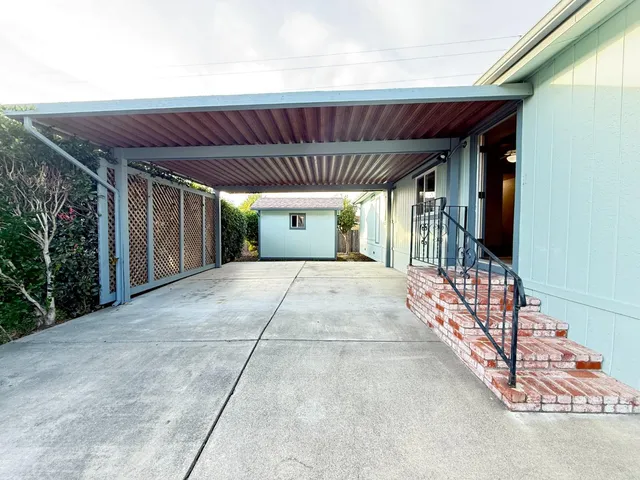 a view of backyard with porch
