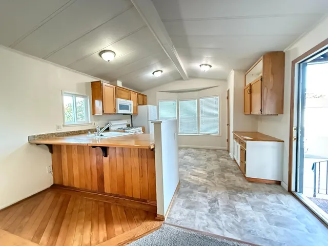a view of kitchen with wooden floor