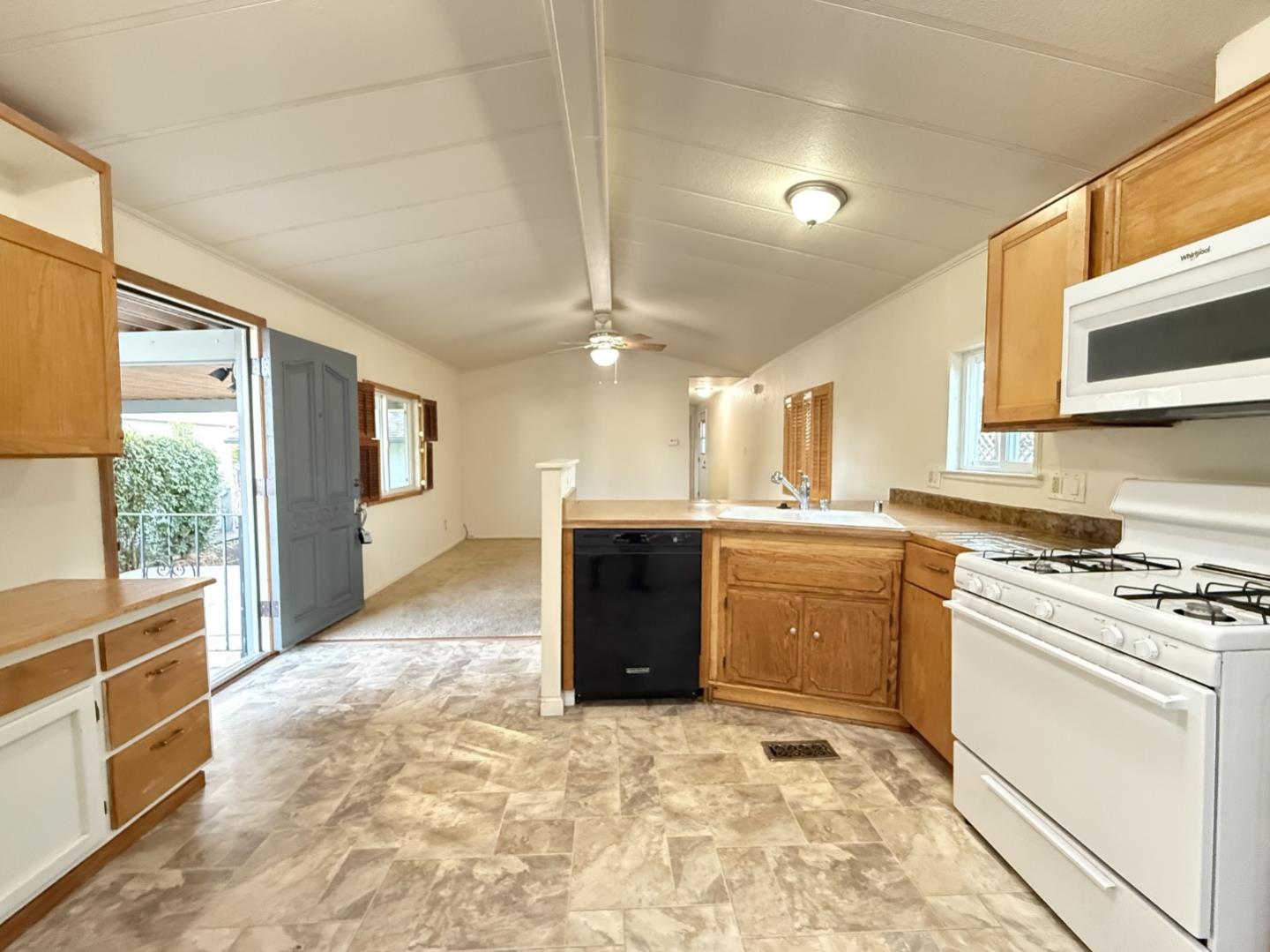 1556 Crown Road, Unit 1556 Petaluma, CA 94954 - Photo 10 of 21 a kitchen with a stove a sink and a refrigerator