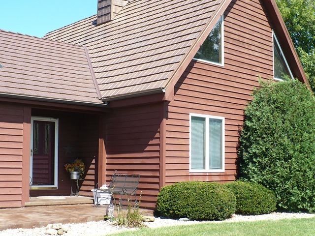 18430 East Twombly Road Rochelle, IL 61068 - Photo 2 of 25 a view of a house with a yard and plants