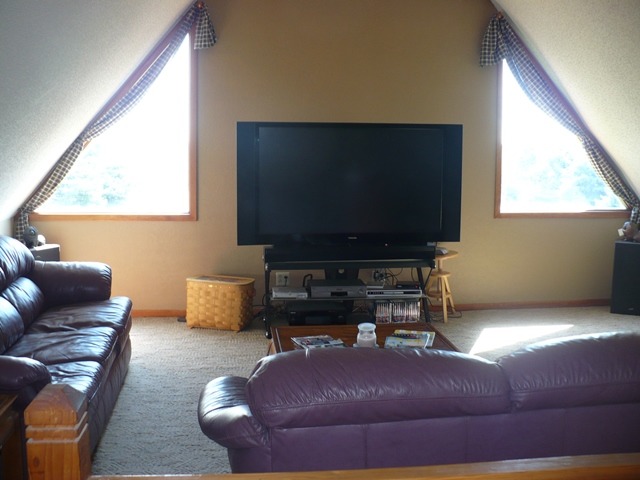 18430 East Twombly Road Rochelle, IL 61068 - Photo 16 of 25 a living room with furniture and a flat screen tv