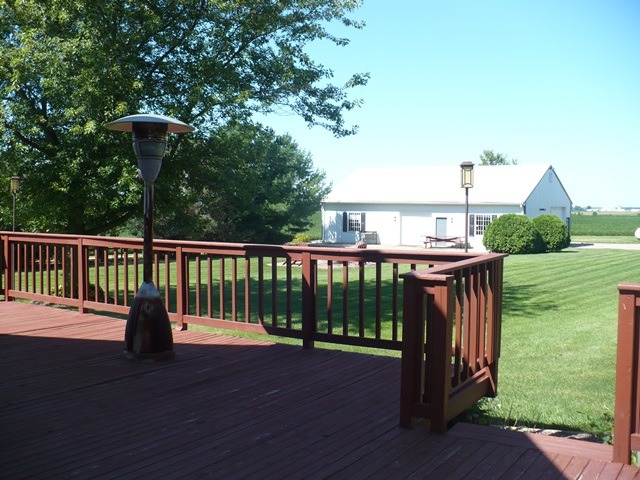 18430 East Twombly Road Rochelle, IL 61068 - Photo 18 of 25 a view of a deck with a table and chairs