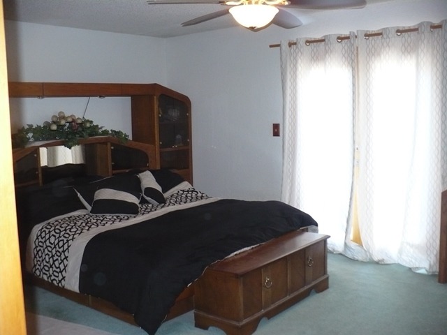 18430 East Twombly Road Rochelle, IL 61068 - Photo 9 of 25 a bedroom with bed and window