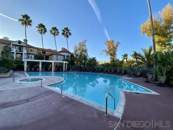 a view of a swimming pool with a patio