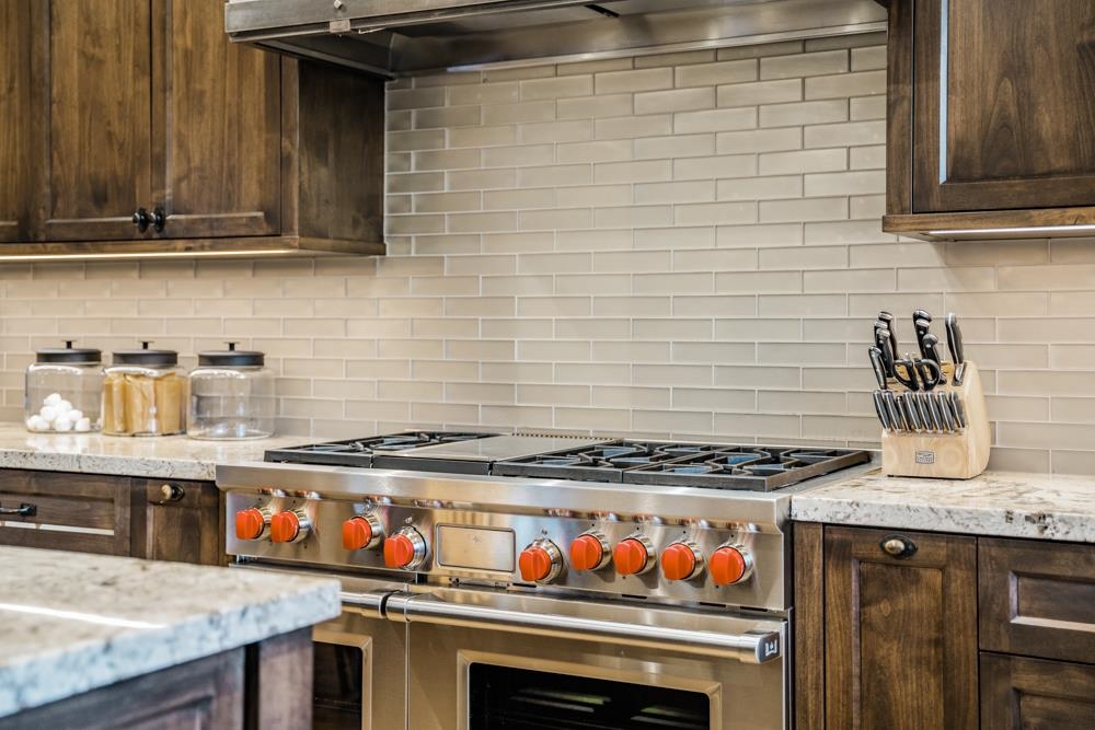 8454 Newhall Drive Truckee, CA 96161 - Photo 8 of 21 a kitchen with stainless steel appliances granite countertop a stove and a sink