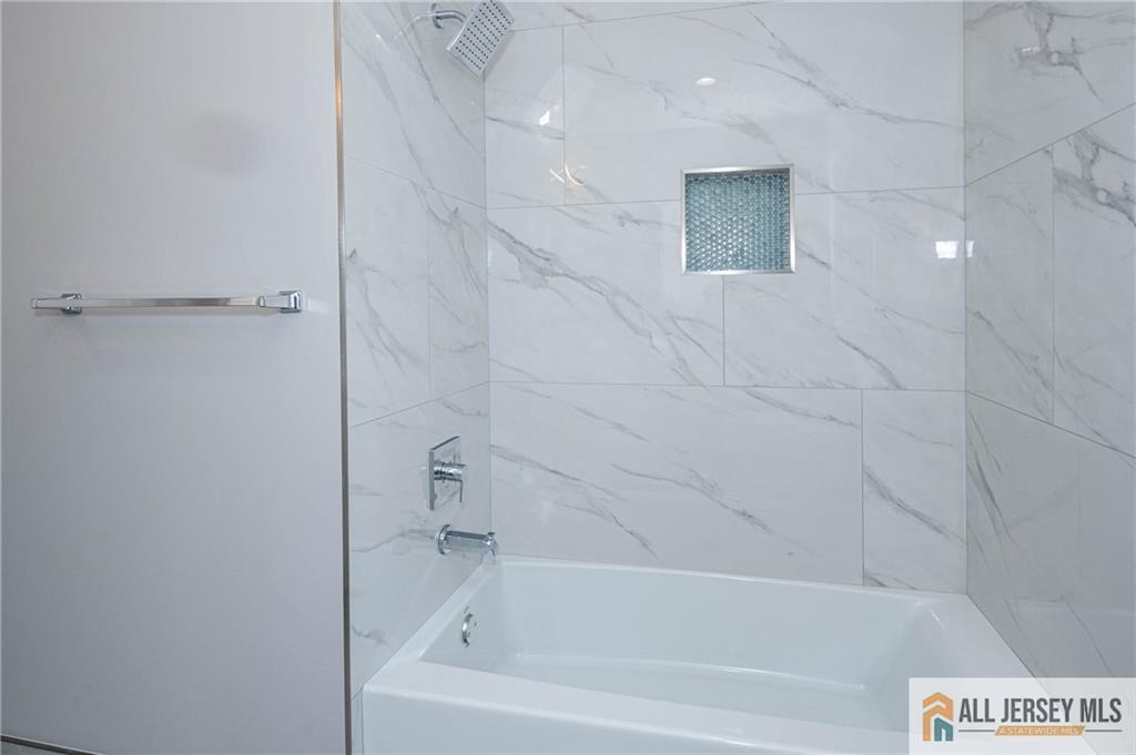 278 Rector Street Perth Amboy, NJ 08861 - Photo 27 of 47 a bathroom with a bathtub