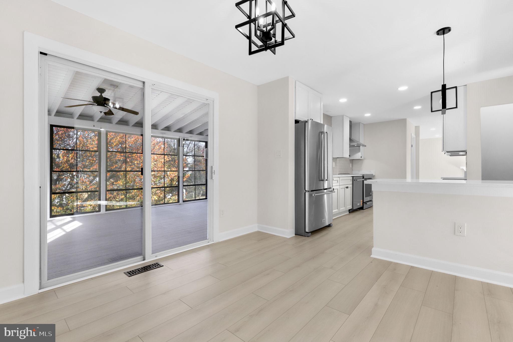 9 Joshua Tree Court Gaithersburg, MD 20878 - Photo 17 of 63 a view of a kitchen with fridge and wooden floor