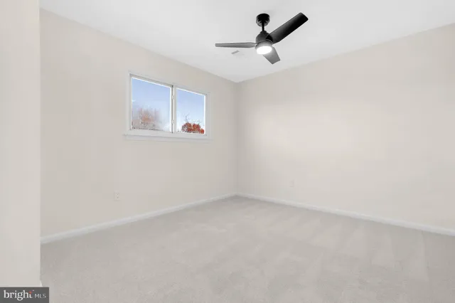 a view of empty room with windows