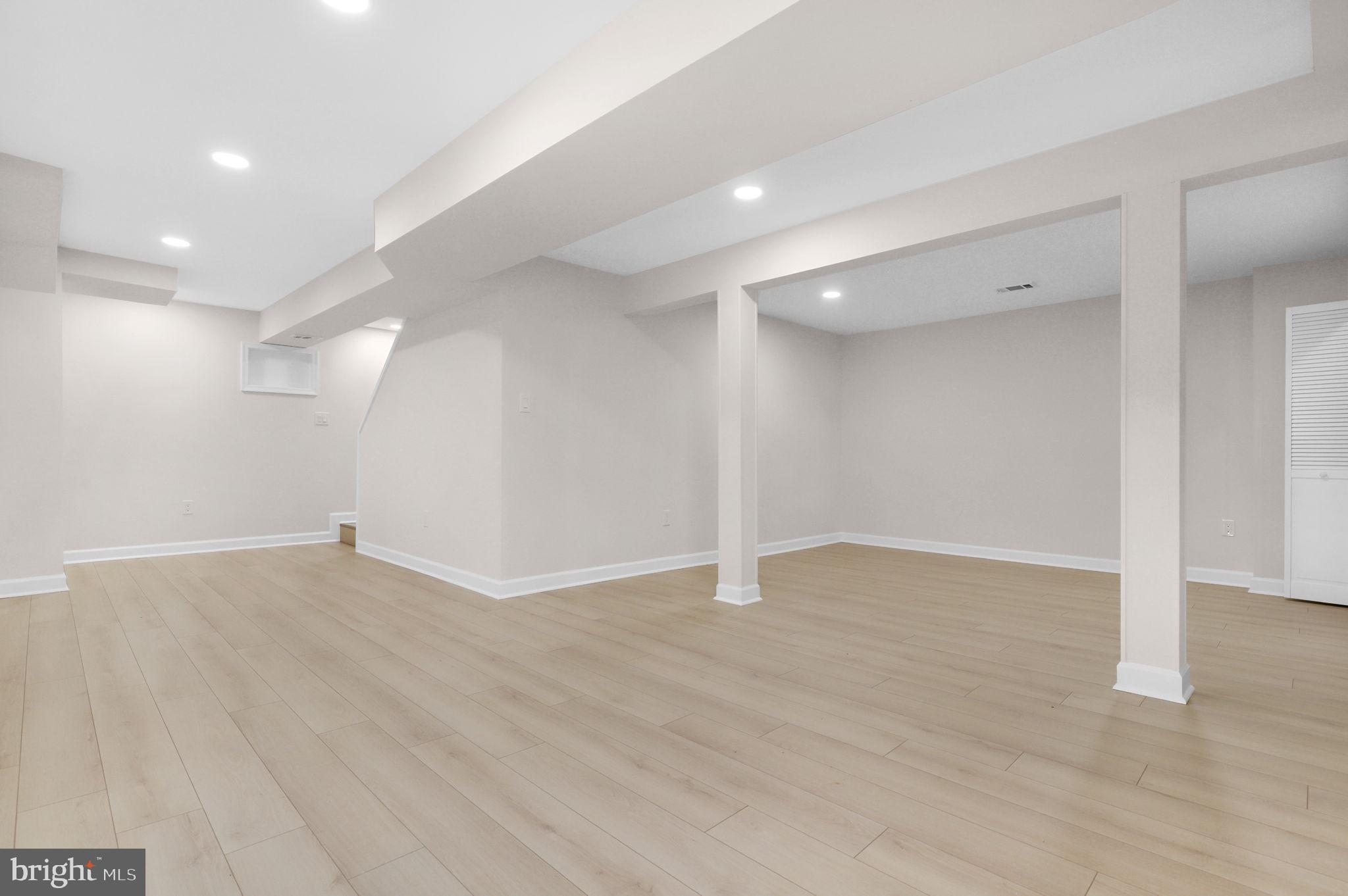 9 Joshua Tree Court Gaithersburg, MD 20878 - Photo 38 of 63 a view of an empty room with wooden floor