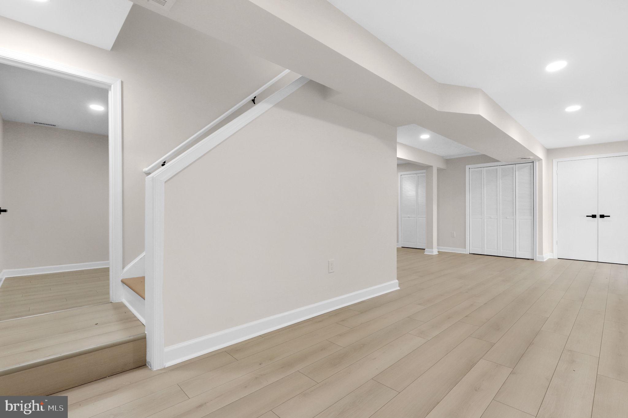 9 Joshua Tree Court Gaithersburg, MD 20878 - Photo 39 of 63 wooden floor in an empty room with a bathroom