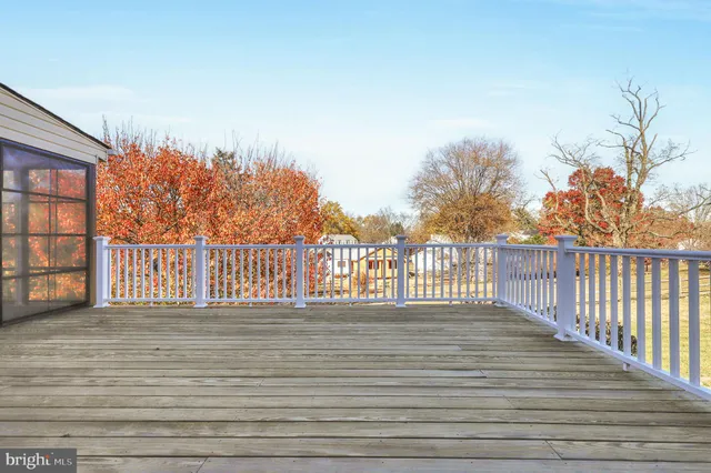 a view of a field with an trees in the background