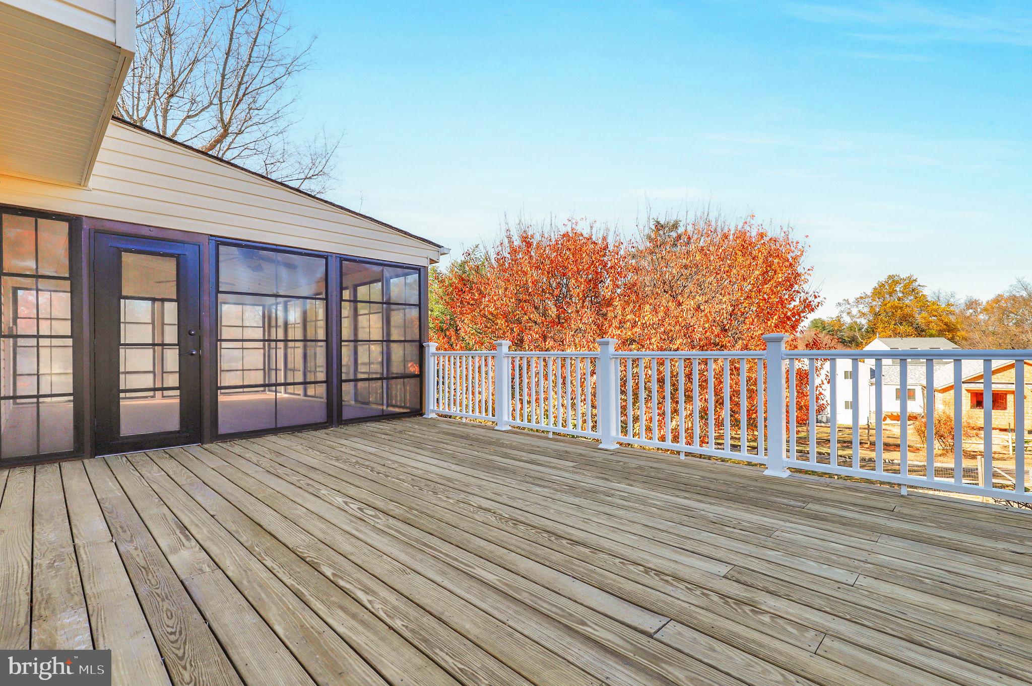 9 Joshua Tree Court Gaithersburg, MD 20878 - Photo 49 of 63 a view of backyard with a deck and wooden floor