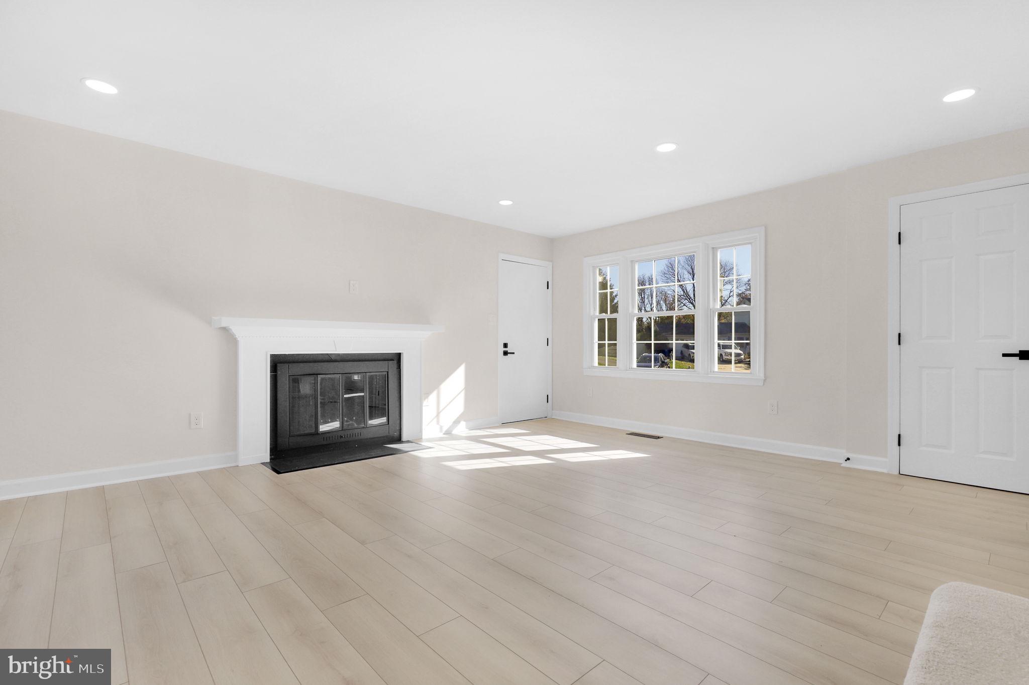 9 Joshua Tree Court Gaithersburg, MD 20878 - Photo 5 of 63 an empty room with windows and fireplace