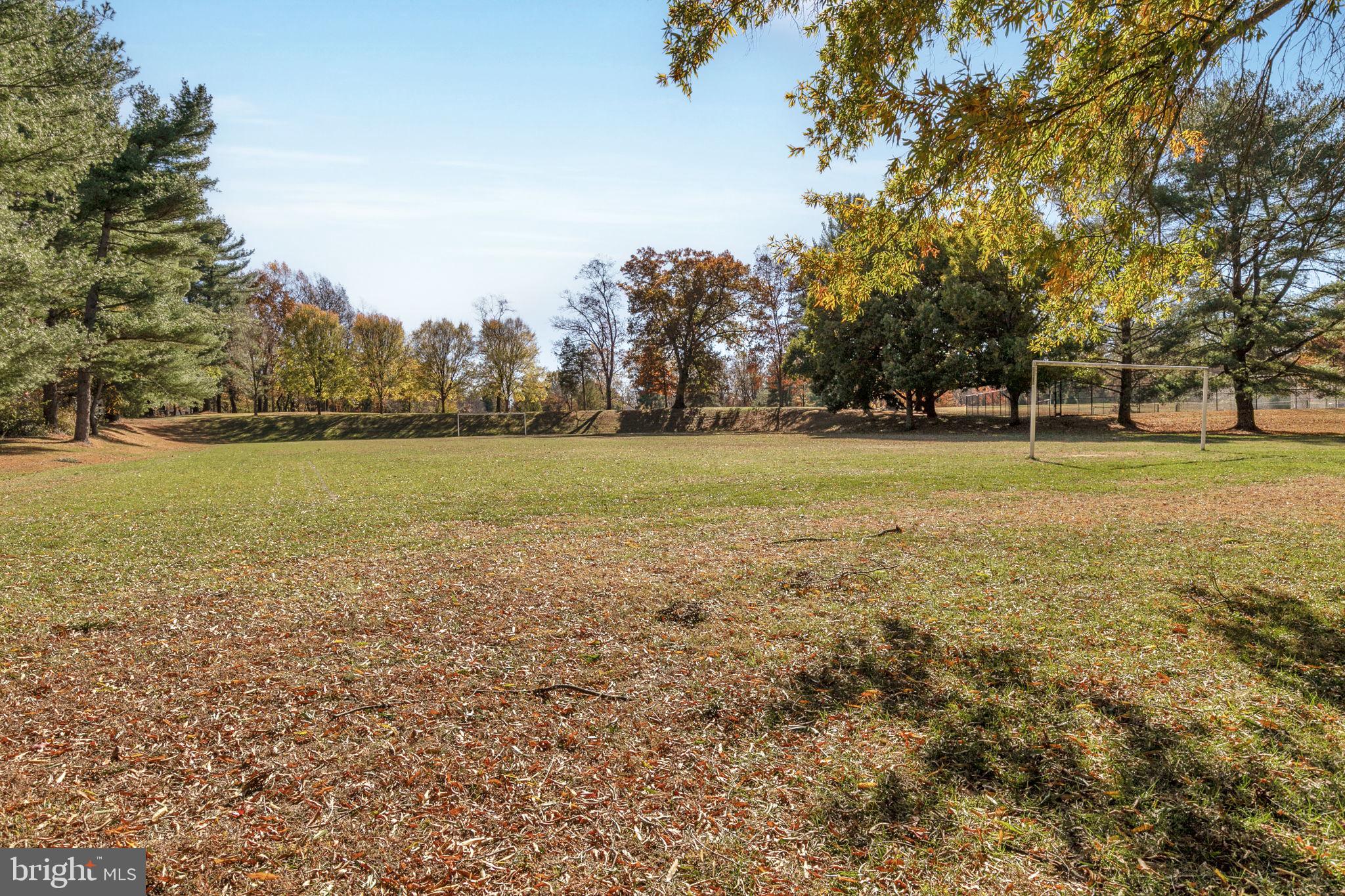 9 Joshua Tree Court Gaithersburg, MD 20878 - Photo 53 of 63 a view of a field with an trees in the background