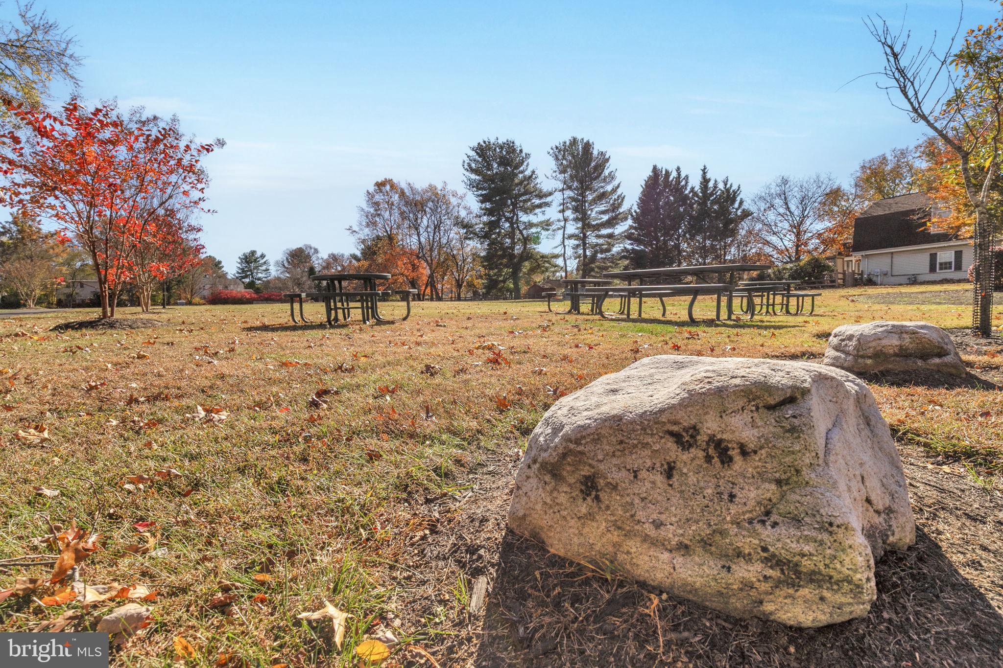 9 Joshua Tree Court Gaithersburg, MD 20878 - Photo 58 of 63 a view of swimming pool with outdoor seating and trees in the background