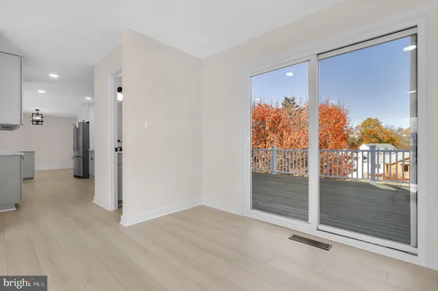 a kitchen with a sink stainless steel appliances and cabinets