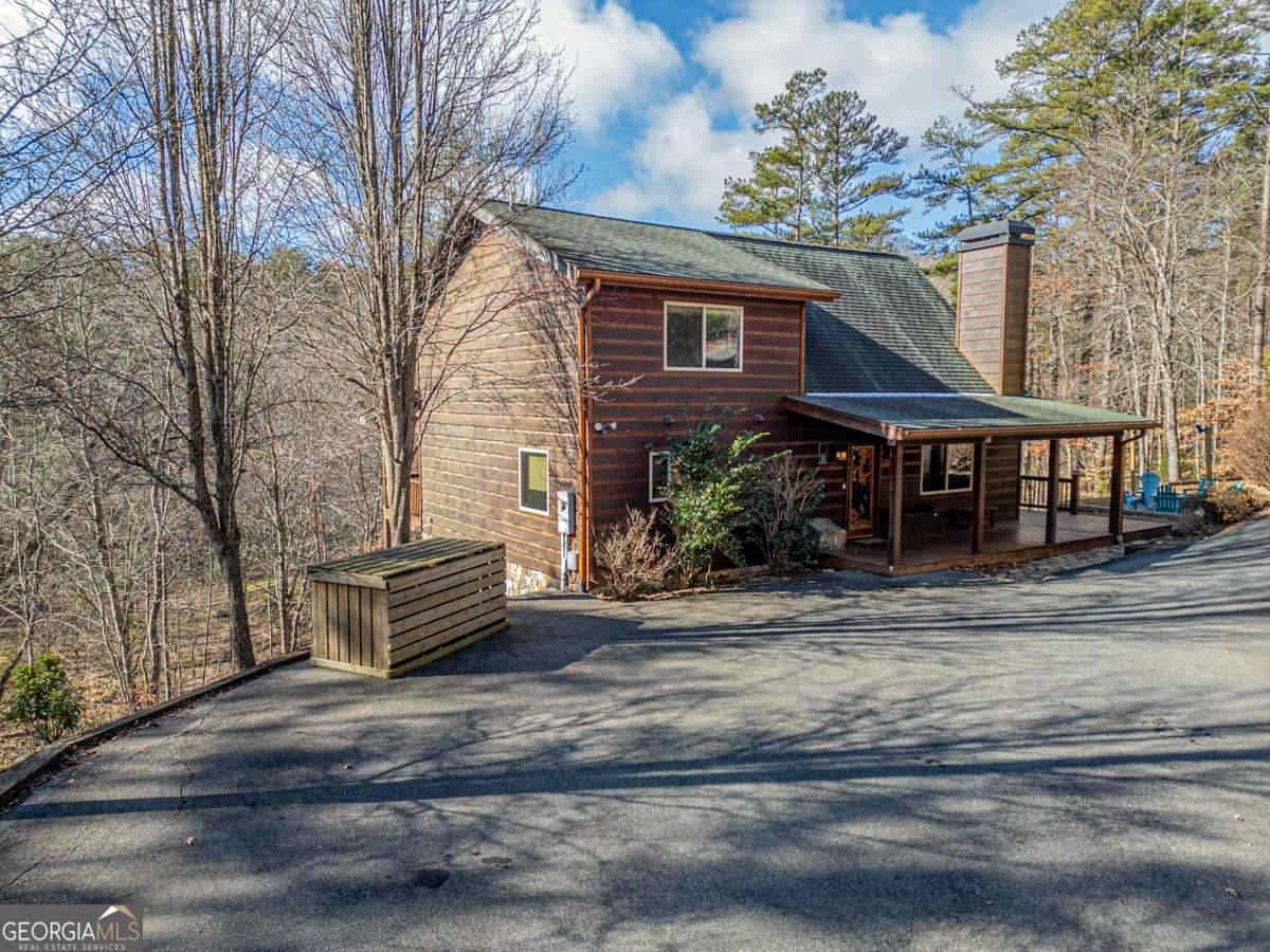 160 Chickasaw Trail Blue Ridge, GA 30513 - Photo 1 of 1 a front view of a house with garden