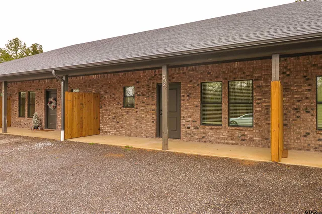 an entrance to house with yard