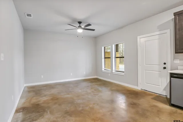 a view of an empty room with a window