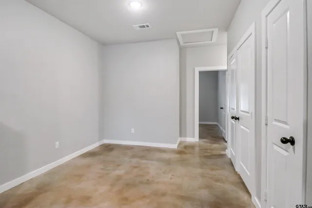 a view of a hallway with a room