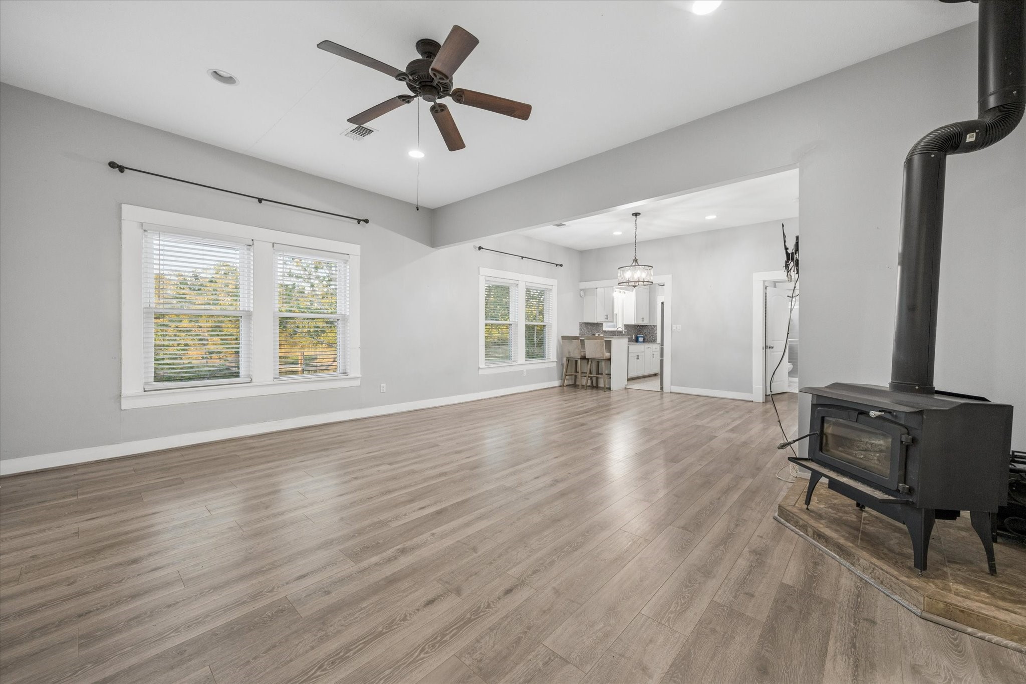 10347 Pless Road Cat Spring, TX 78933 - Photo 8 of 41 Spacious, open concept living space with a wood burning stove.