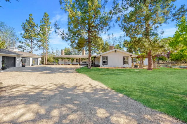 a view of house with a yard