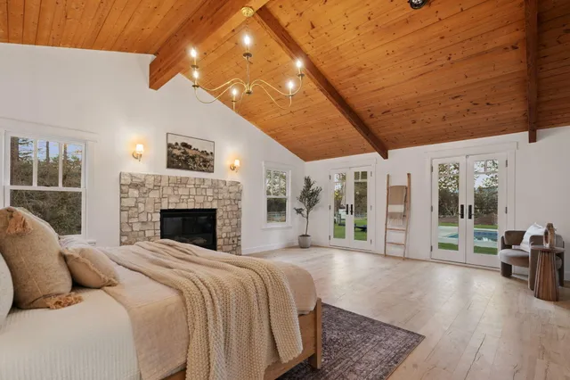 a bath tub sitting in a bathroom next to a window