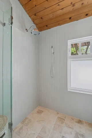 a bedroom with a large bed and a large window