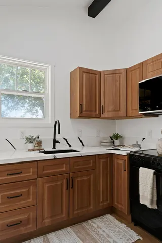 an aerial view of a forest with mountains